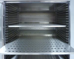 perforated stainless steel shelves inside a desiccator chamber